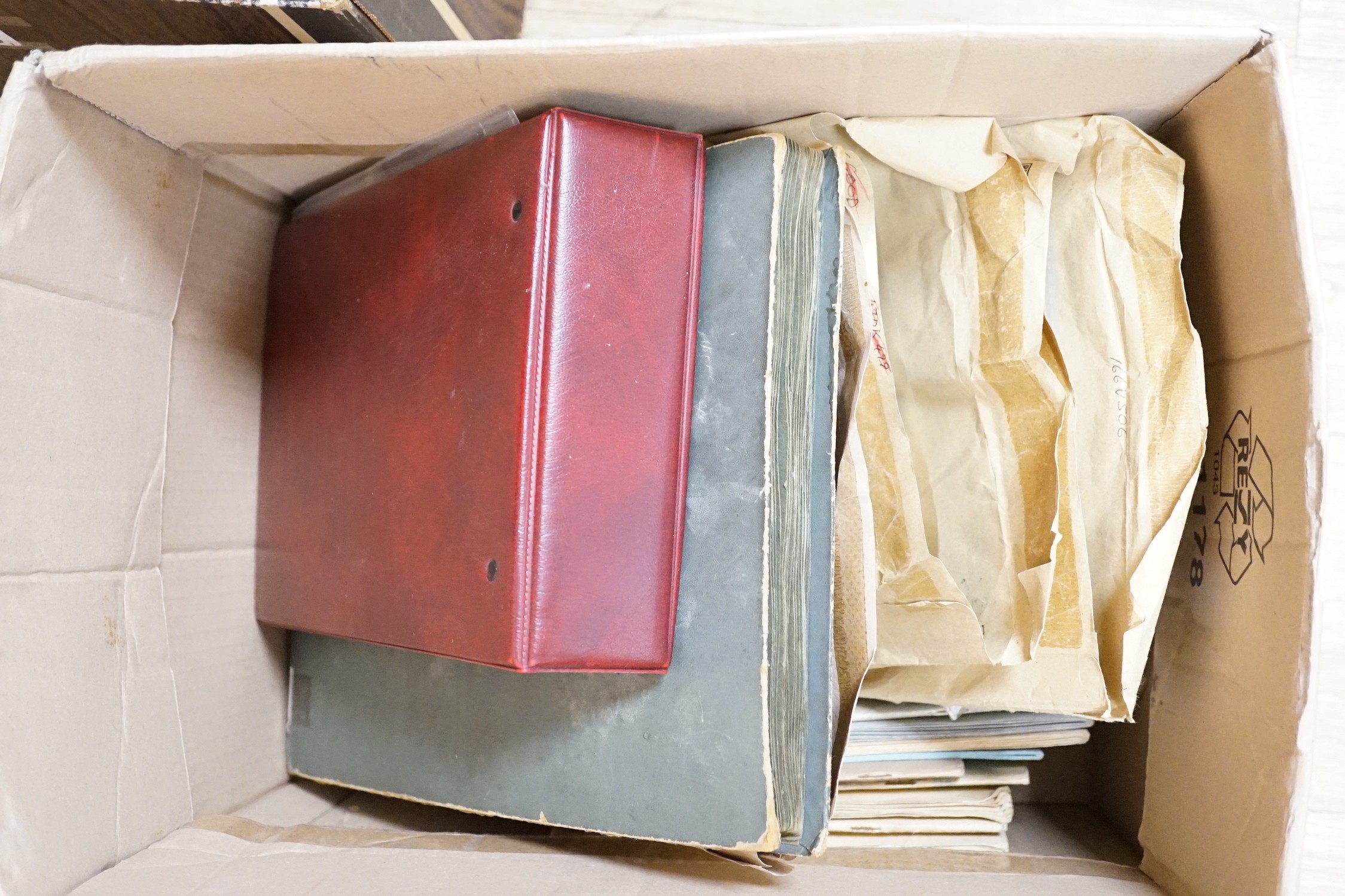 A box of postcards and cigarette cards in two albums and loose topographical including Isle of Wight